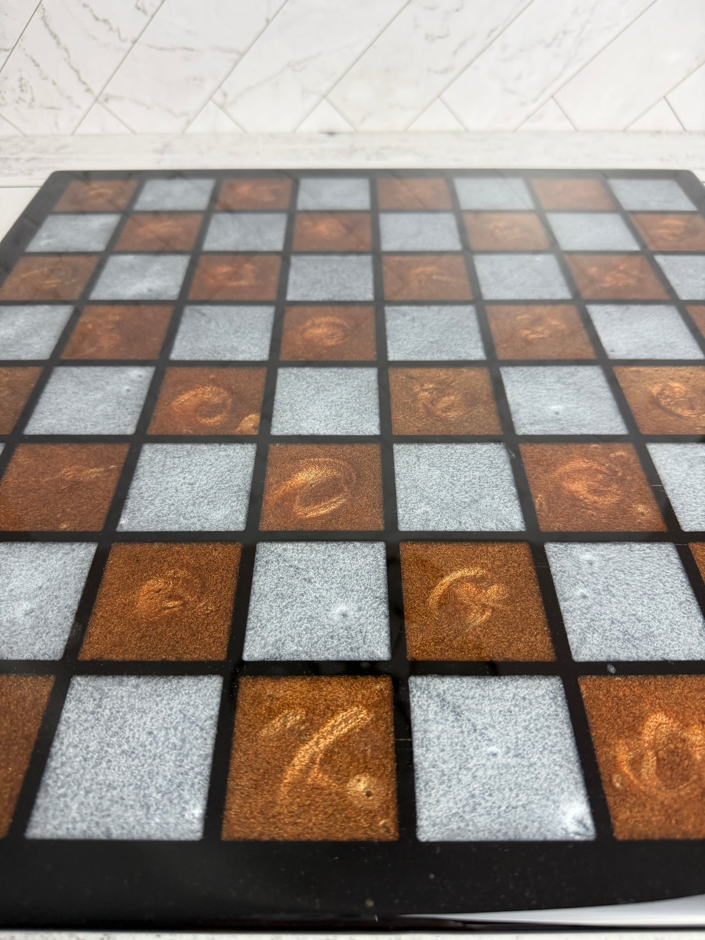Handcrafted resin chess board with swirled bronze and silver epoxy squares on black frame — Bees Boards